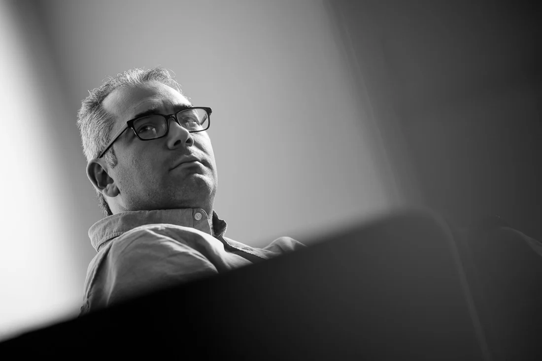 speaker connector thought leader Michael Roderick branded lifestyle portrait looking up while sitting on couch