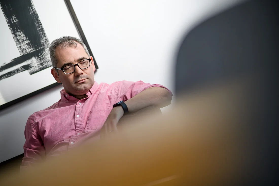 speaker connector thought leader Michael Roderick branded lifestyle portrait thinking while on couch