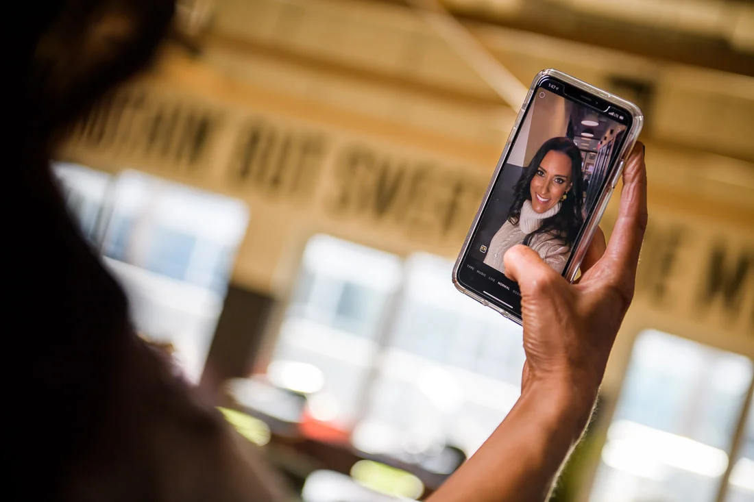 branded lifestyle portrait fitness &amp; health coach Kristi Data taking a selfie