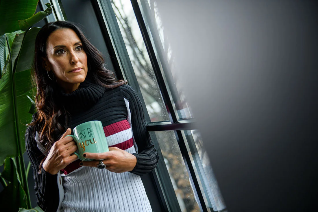 branded lifestyle portrait fitness &amp; health coach Kristi Data looking out window