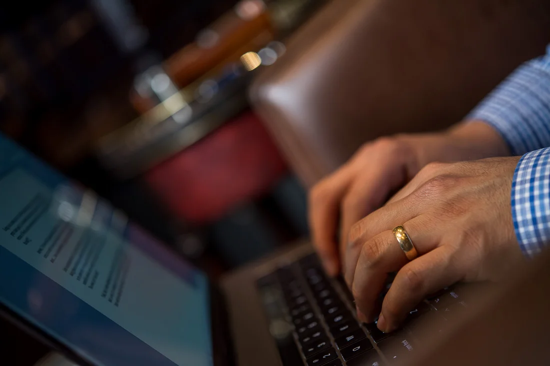 NYC Branded Lifestyle Portraits Cigar Merchant Luis Paredes typing on keyboard