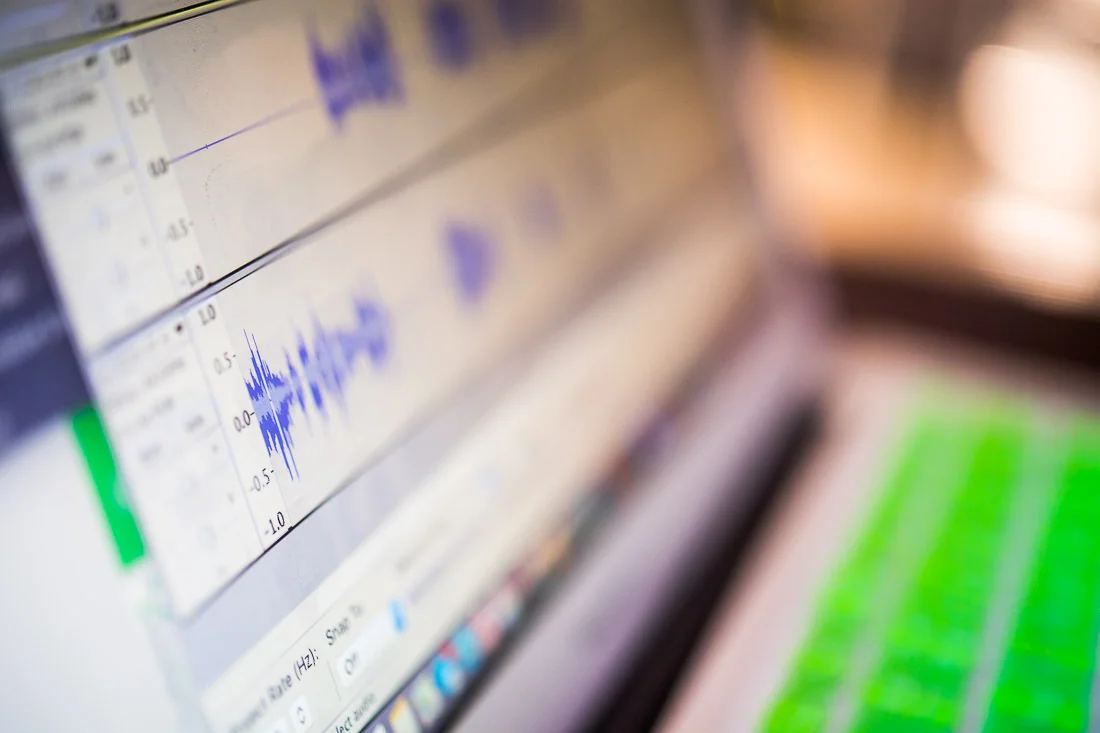 NYC Branded Lifestyle Portraits Speaker Thrive Lou Diamond computer working on podcast