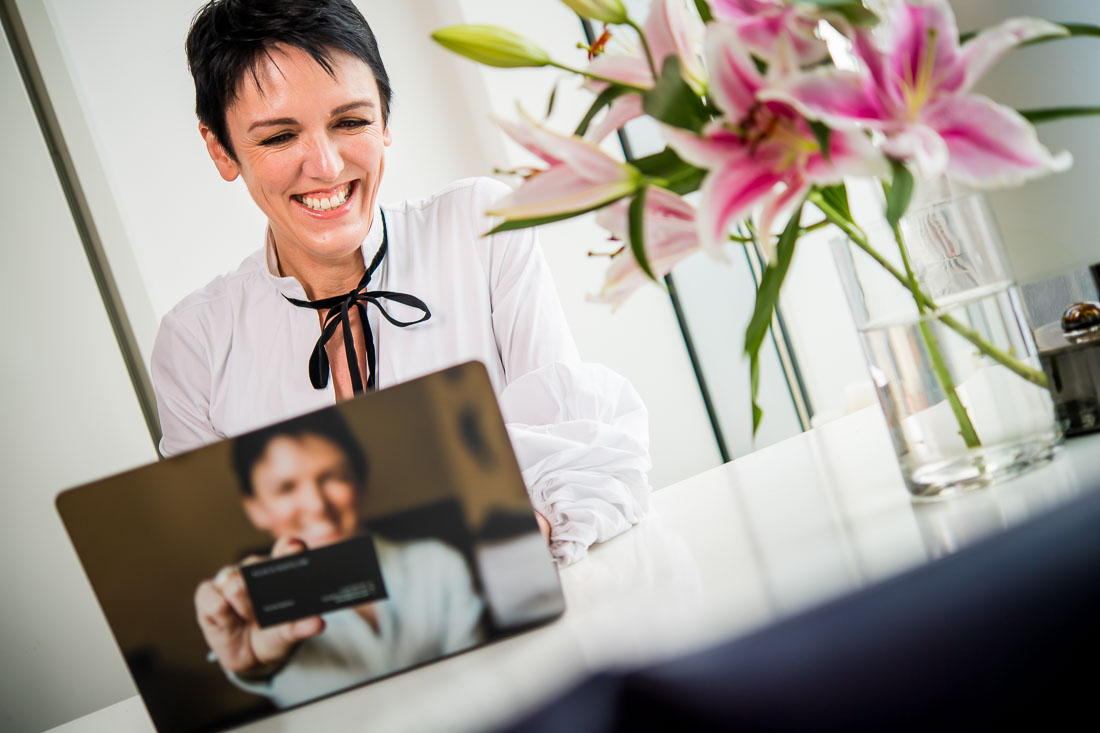 NYC Branded Lifestyle Portraits speaker image consultant Sylvie diGiusto working on computer