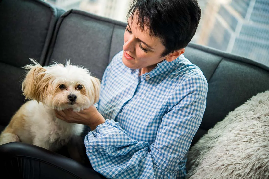NYC Branded Lifestyle Portraits speaker image consultant Sylvie diGiusto playing with dog