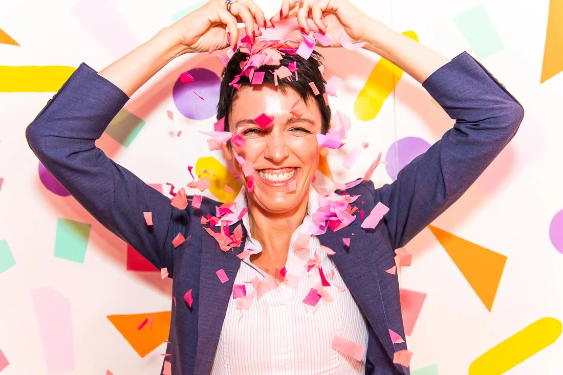 NYC Branded Lifestyle Portraits speaker image consultant Sylvie diGiusto pouring confetti on head