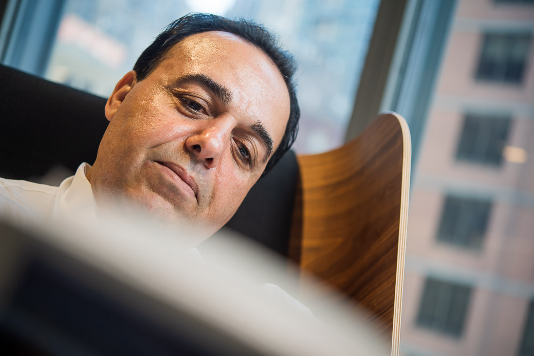 NYC Branded Lifestyle Portraits Sales Executive Speaker Anthony Chaine face as he reads HBR