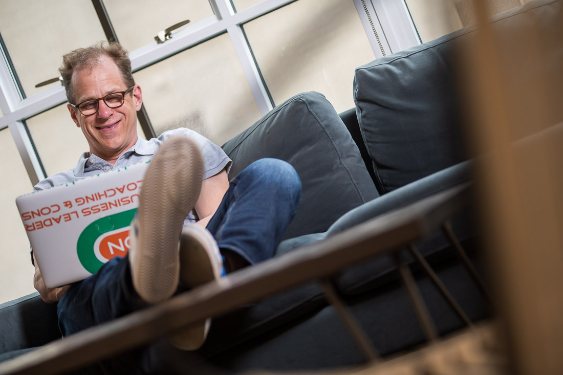 NYC Branded Lifestyle Portraits speaker author coach Michael O'Brien working on laptop