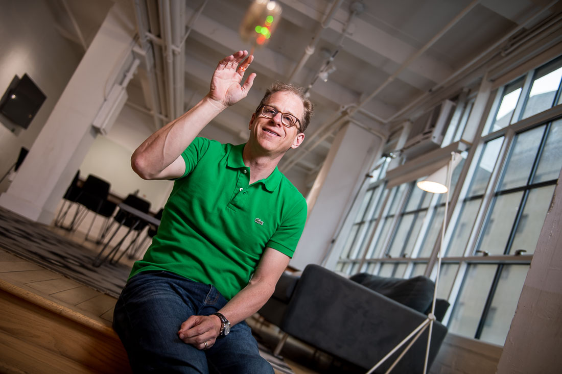 NYC Branded Lifestyle Portraits speaker author coach Michael O'Brien playing with a yo-yo