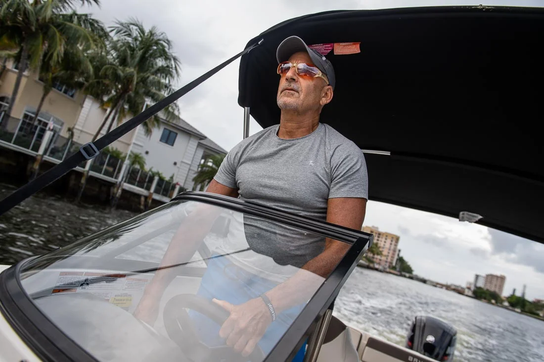 NYC Branded Lifestyle Portraits speaker author Ted Rubin driving his boat