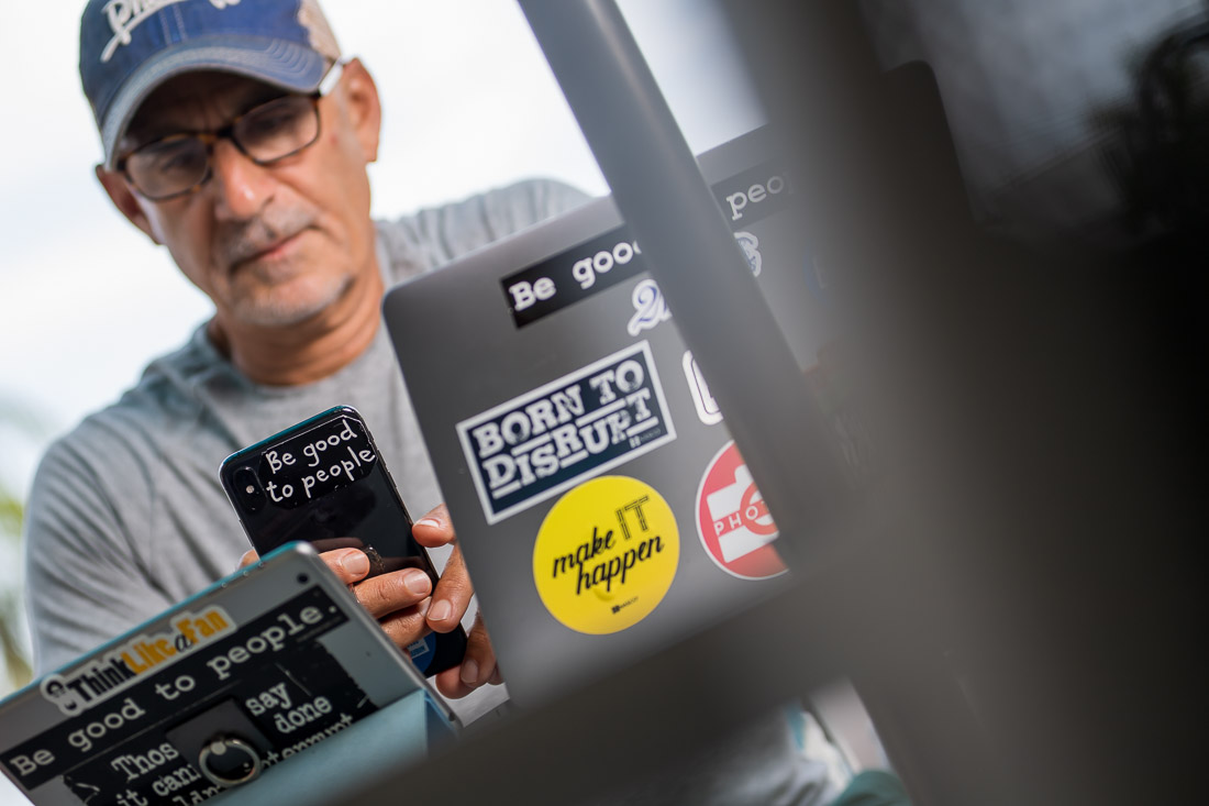 NYC Branded Lifestyle Portraits speaker author Ted Rubin working on laptop and phone