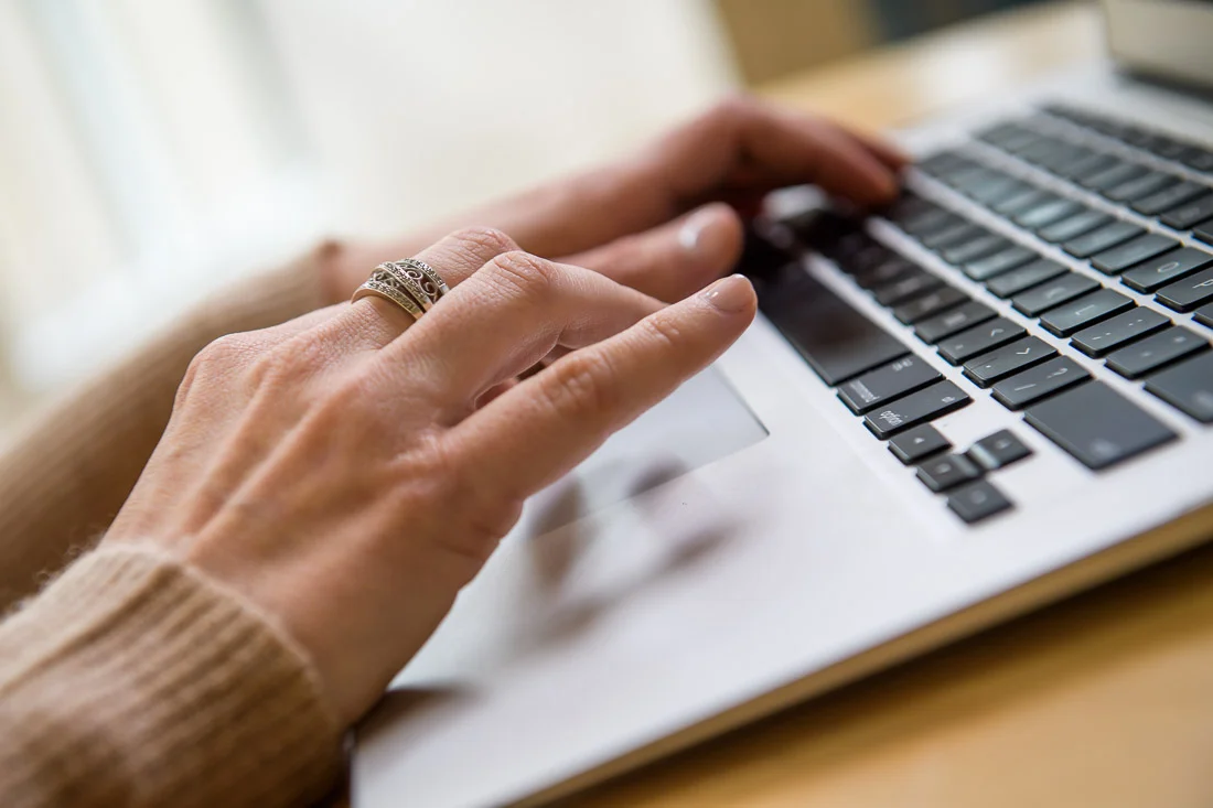NYC Branded Lifestyle Portraits Lifestyle Strategist Dr Samantha Hiotakis hands typing on computer