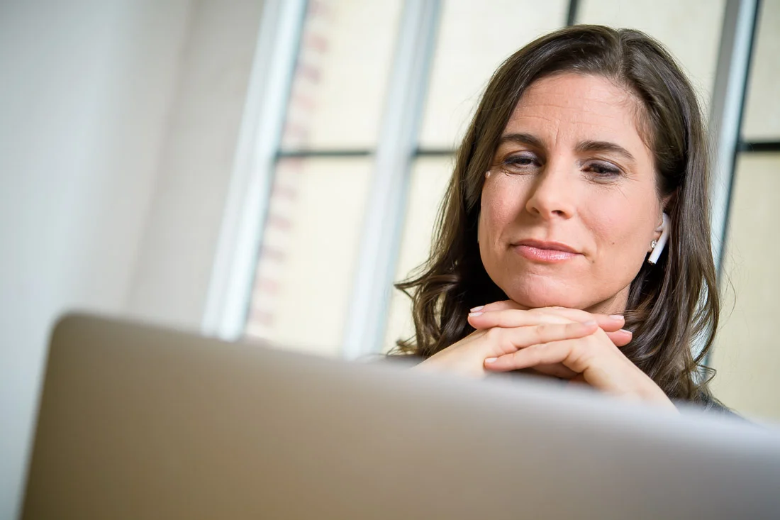 NYC Branded Lifestyle Portraits Lifestyle Strategist Dr Samantha Hiotakis working on laptop