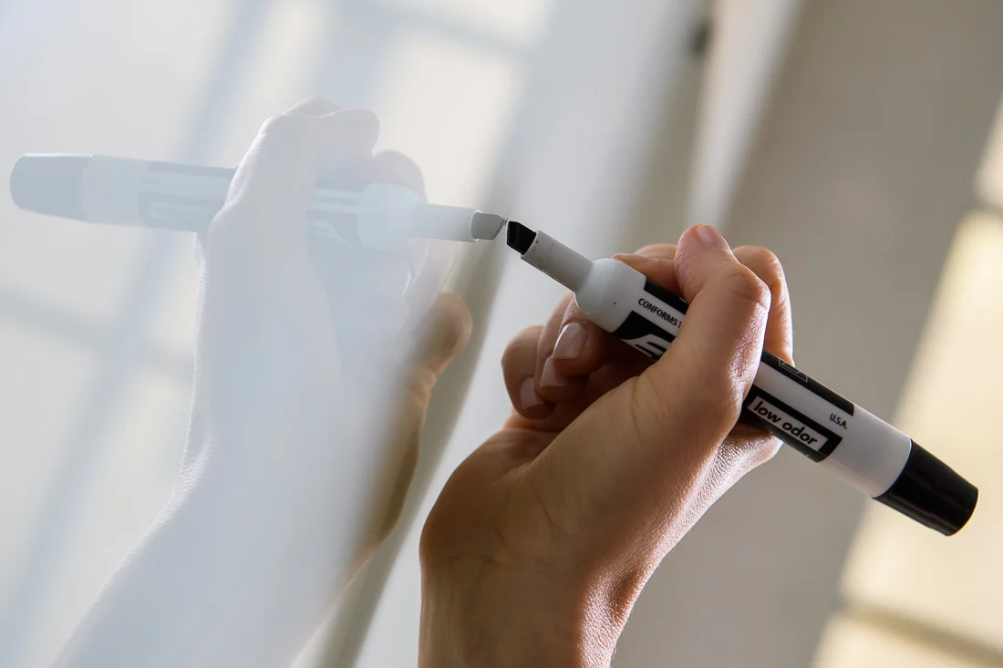 NYC Branded Lifestyle Portraits Lifestyle Strategist Dr Samantha Hiotakis hand close up writing on white board