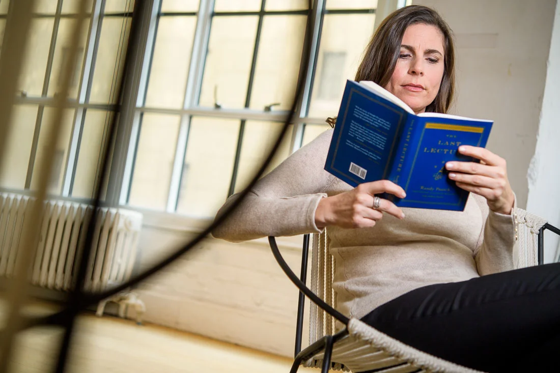 NYC Branded Lifestyle Portraits Lifestyle Strategist Dr Samantha Hiotakis reading a book