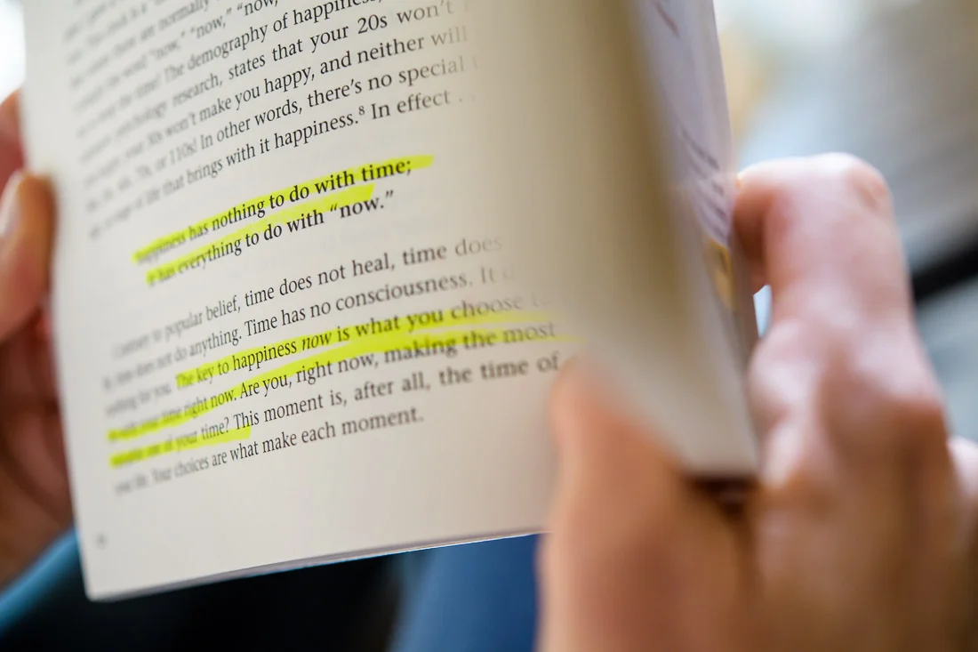 NYC Branded Lifestyle Portraits Lifestyle Strategist Dr Samantha Hiotakis closeup hand reading a book