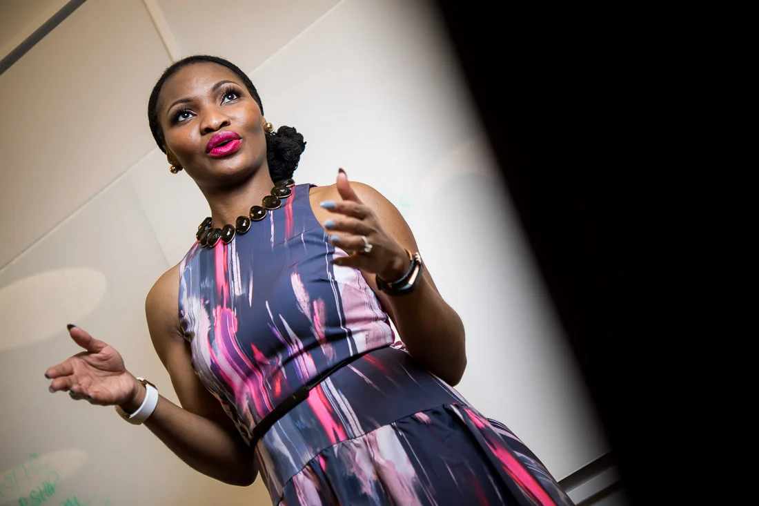 NYC Branded Lifestyle Portraits Lawyer Speaker Chinwe Esimai speaking in front of the room