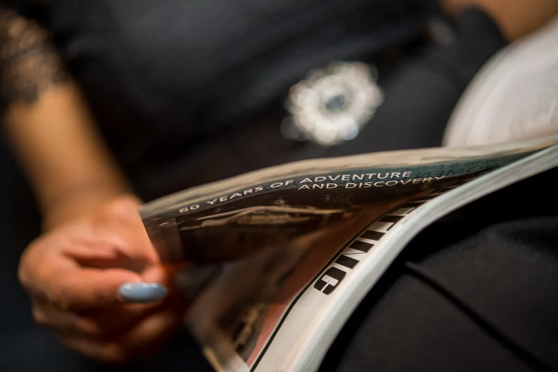 NYC Branded Lifestyle Portraits Lawyer Speaker Chinwe Esimai hand flipping magazine page