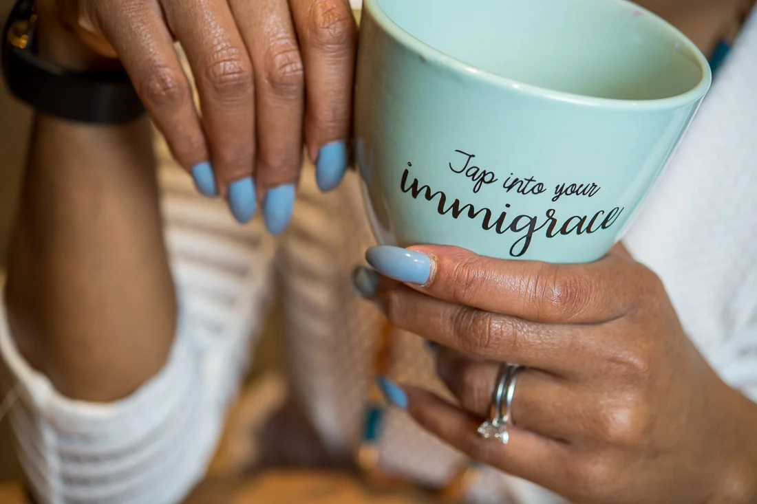 NYC Branded Lifestyle Portraits Lawyer Speaker Chinwe Esimai holding coffee mug