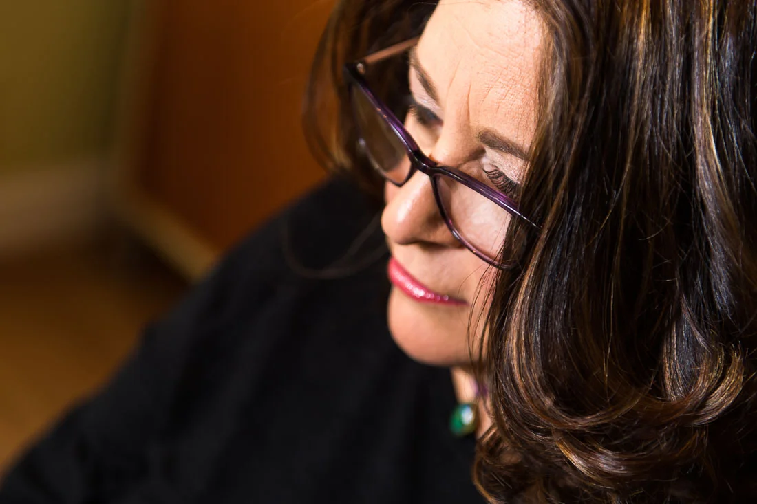 NYC Branded Lifestyle Portraits Social Pivot PR Donna Cravotta face focused on computer screen