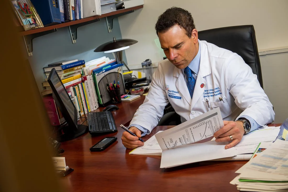 NYC Branded Lifestyle Portraits Doctor Author Dr. Brian Lima working in office