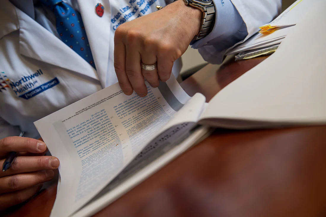 NYC Branded Lifestyle Portraits Doctor Author Dr. Brian Lima closeup hands going through notes