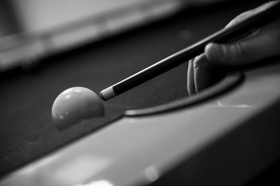 NYC Branded Lifestyle Portraits Doctor Author Dr. Brian Lima closeup pool cue with ball