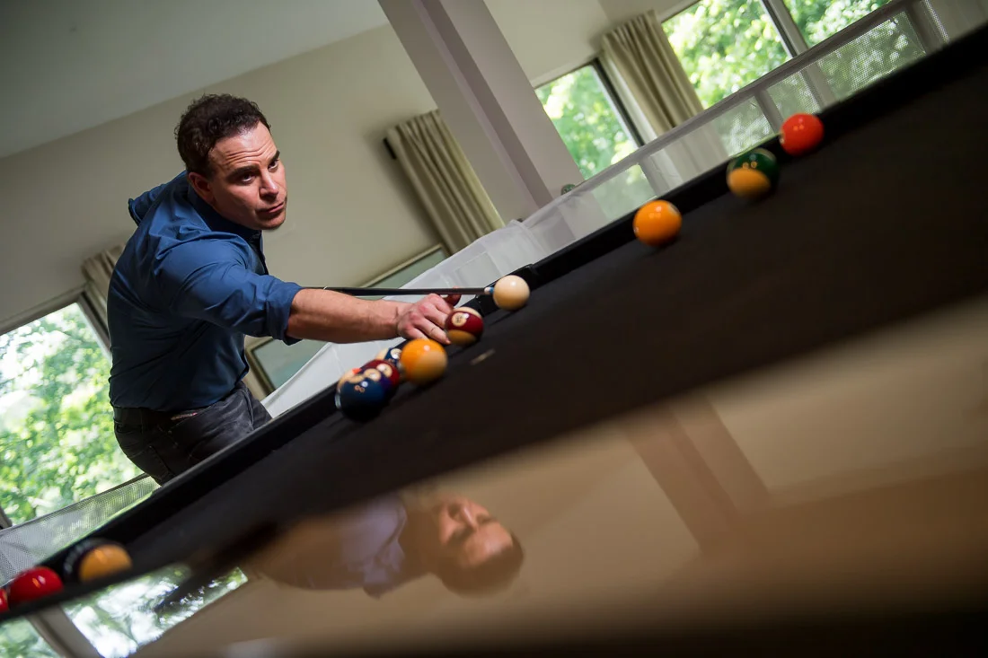 NYC Branded Lifestyle Portraits Doctor Author Dr. Brian Lima playing pool