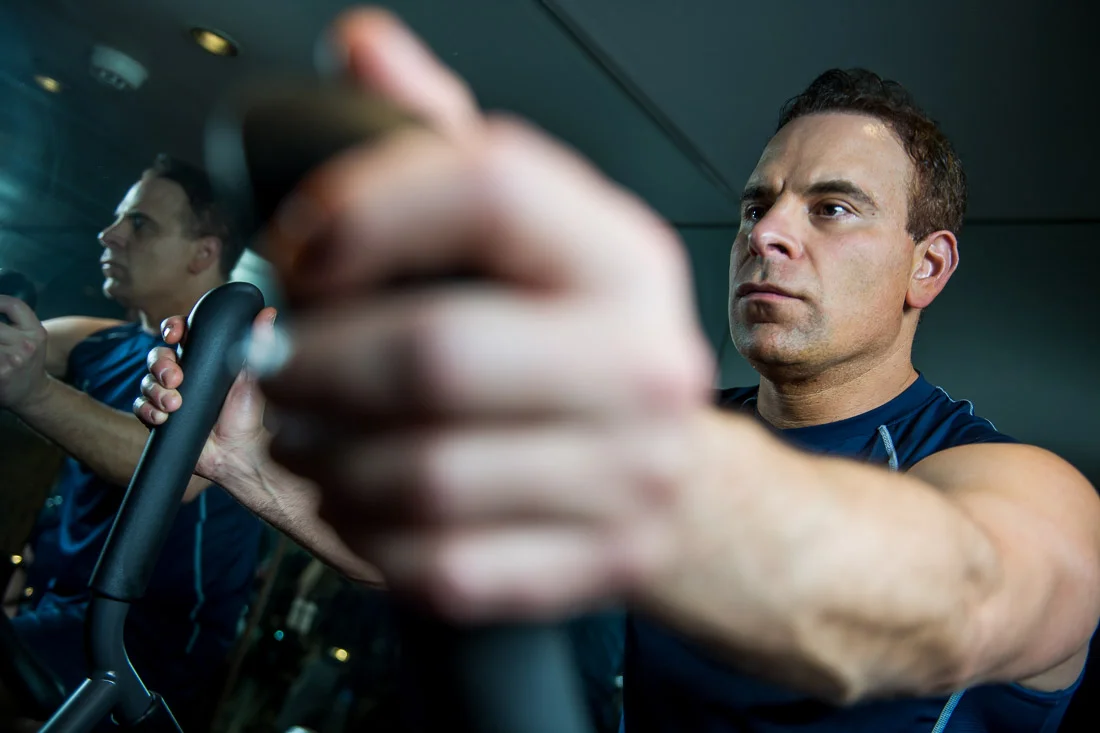 NYC Branded Lifestyle Portraits Doctor Author Dr. Brian Lima on elliptical machine