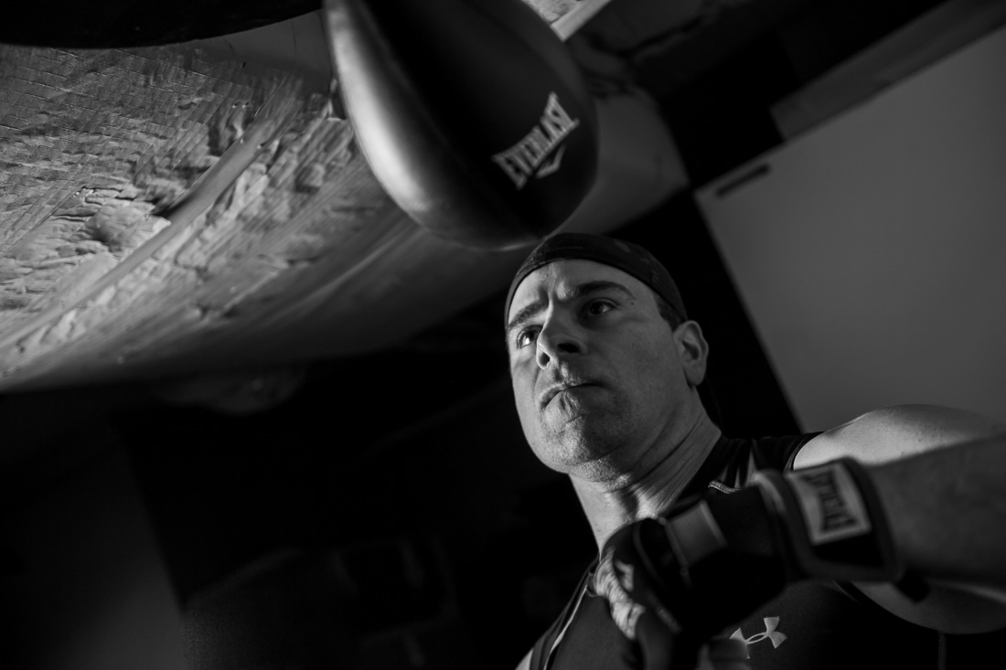 NYC Branded Lifestyle Portraits Doctor Author Dr. Brian Lima hitting the speedbag