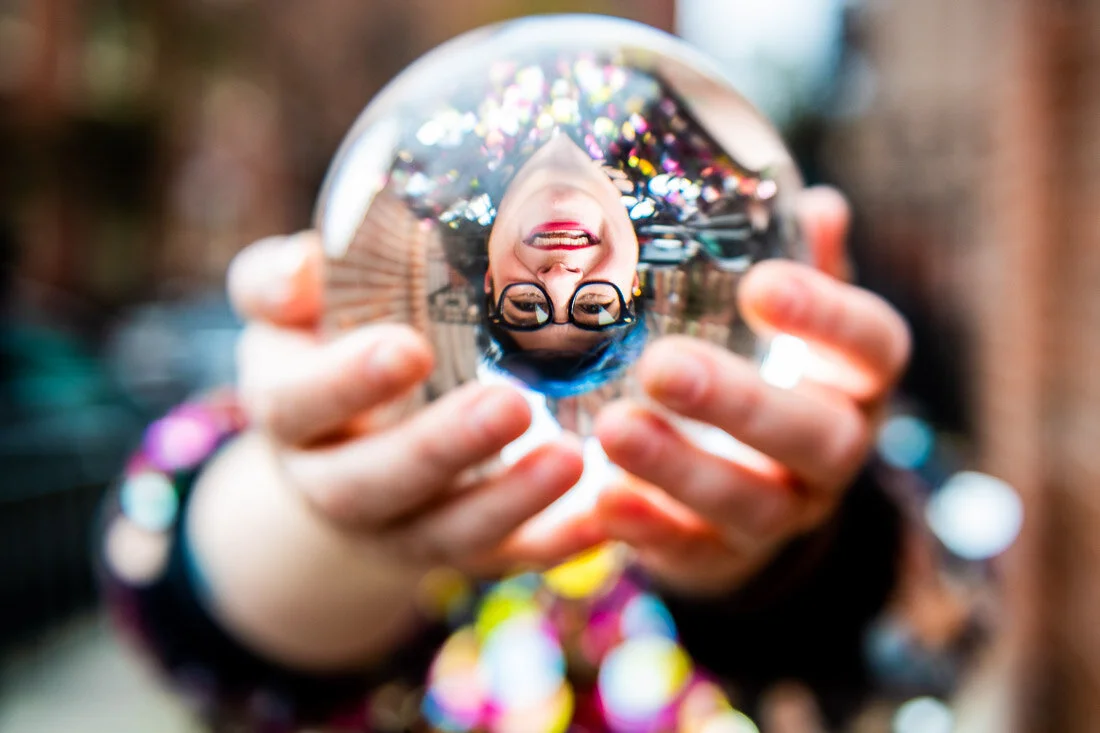 NYC Branded Lifestyle Portraits speaker Jess Pettitt holding a crystal ball