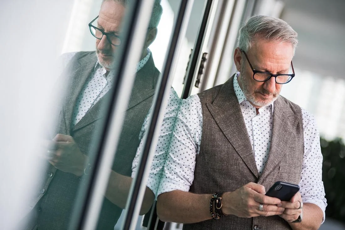 NYC branded lifestyle portrait Speaker Lingo Author Jeffrey Shaw working on his phone