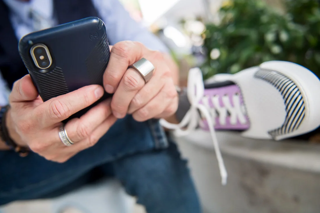 NYC branded lifestyle portrait Speaker Lingo Author Jeffrey Shaw hands typing on his phone