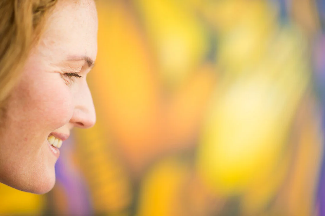 NYC branded lifestyle portrait Speaker Mary Rooney smiling while looking off camera