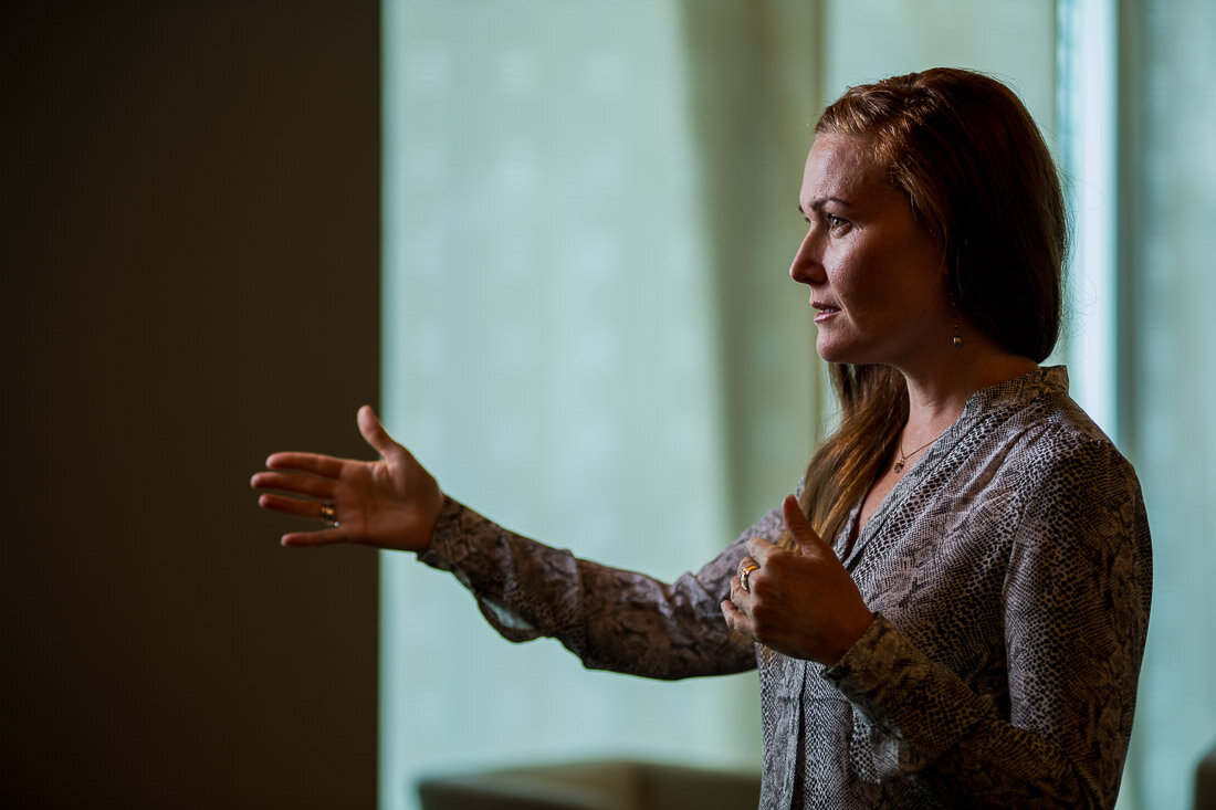 NYC branded lifestyle portrait Speaker Mary Rooney speaking in front of audience