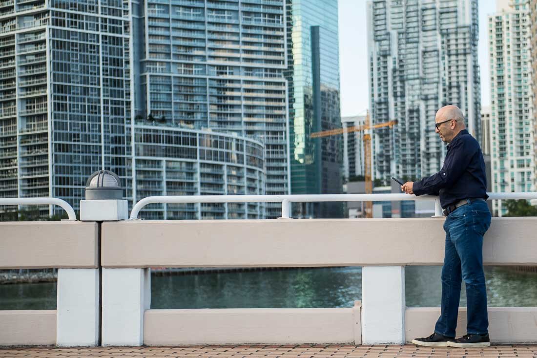 NYC Branded Lifestyle Portrait Howie Doin It Howie Kra working on his phone