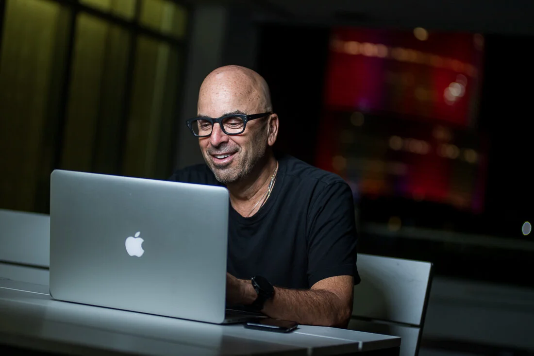 NYC Branded Lifestyle Portrait Howie Doin It Howie Kra working on laptop