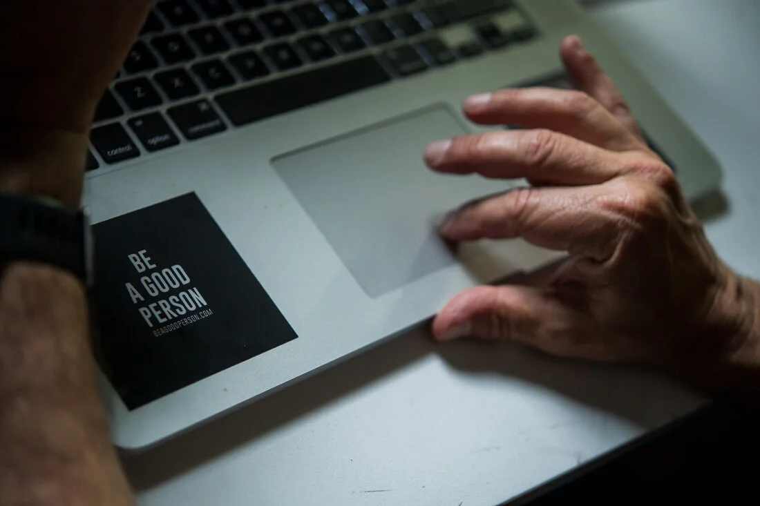 NYC Branded Lifestyle Portrait Howie Doin It Howie Kra be a good person sticker on laptop