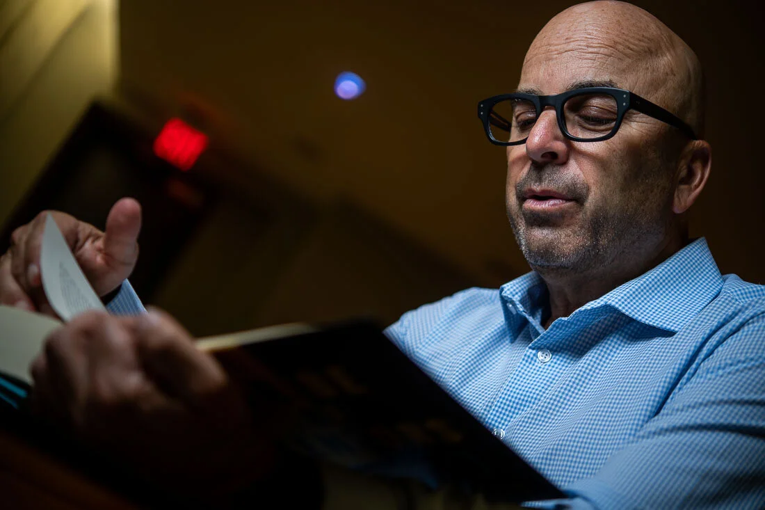 NYC Branded Lifestyle Portrait Howie Doin It Howie Kra reading a book