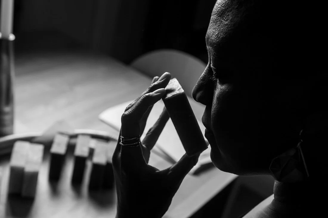 NYC branded lifestyle portrait Speaker Author Denise Jacobs smelling her soaps