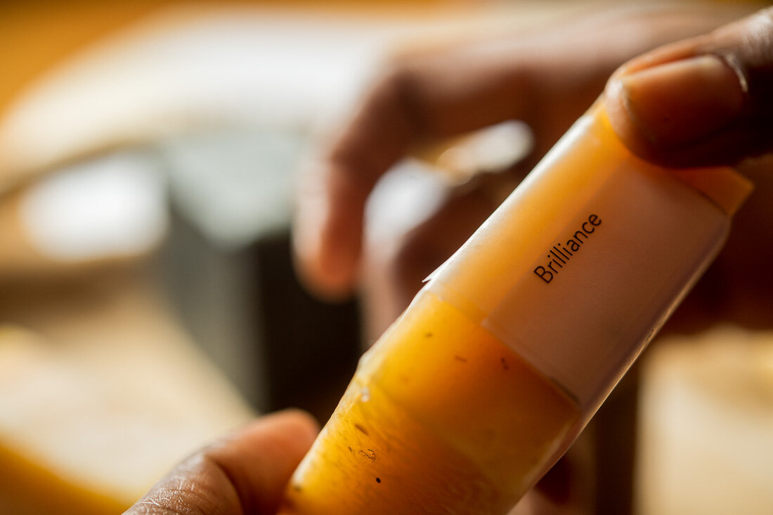 NYC branded lifestyle portrait Speaker Author Denise Jacobs holding homemade soap named brilliance