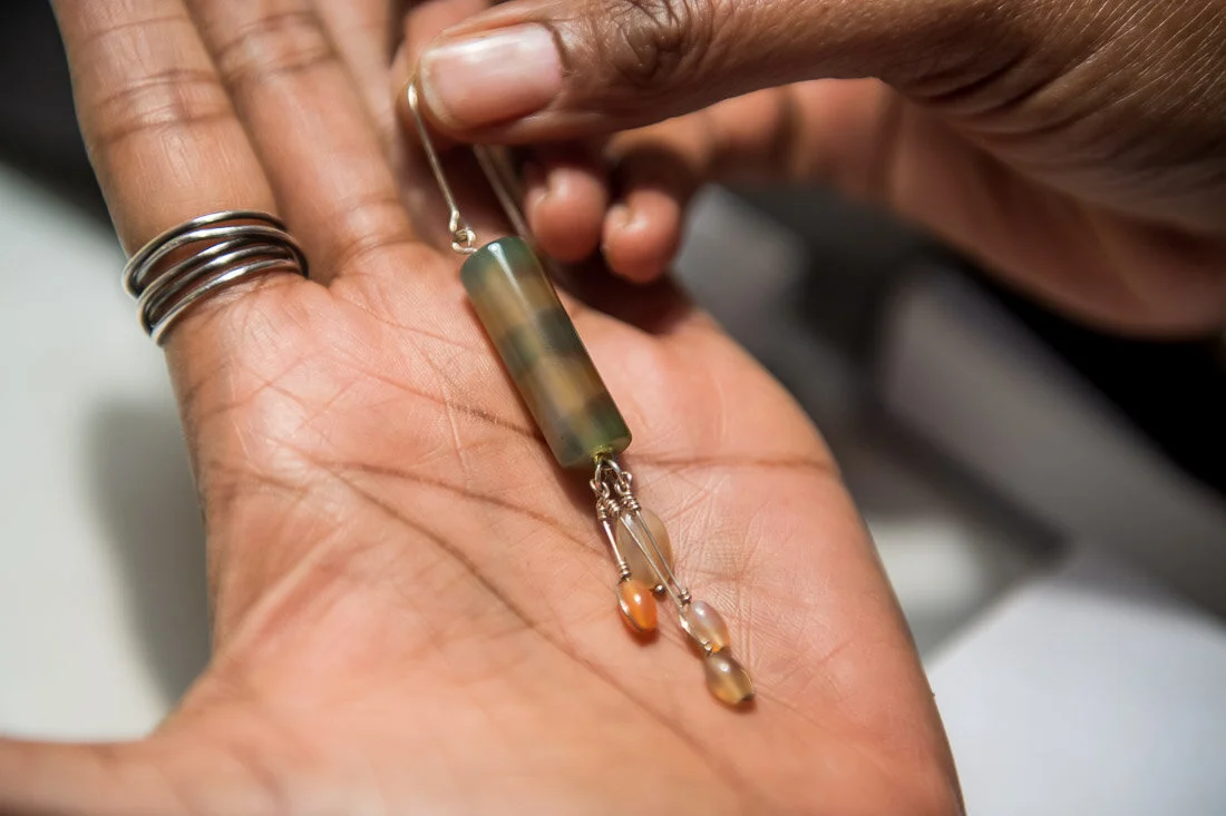 NYC branded lifestyle portrait Speaker Author Denise Jacobs earring in her palm