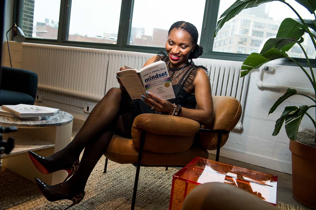 NYC personal branding photo Speaker Chinwe Esimai reading a book