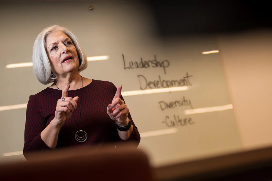 NYC Personal Branding Photography Speaker Trainer Janet Neal speaking in front of audience