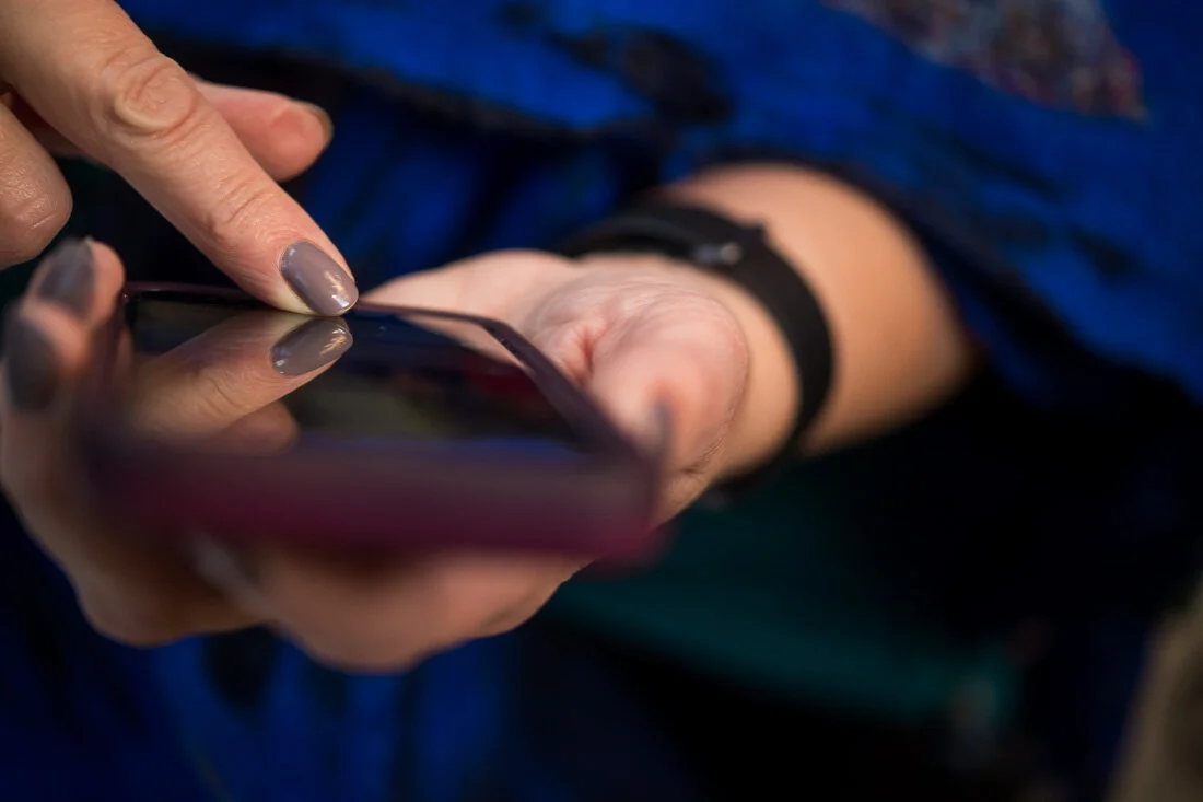 NYC Personal Branding Photography Speaker Trainer Janet Neal hands typing on phone