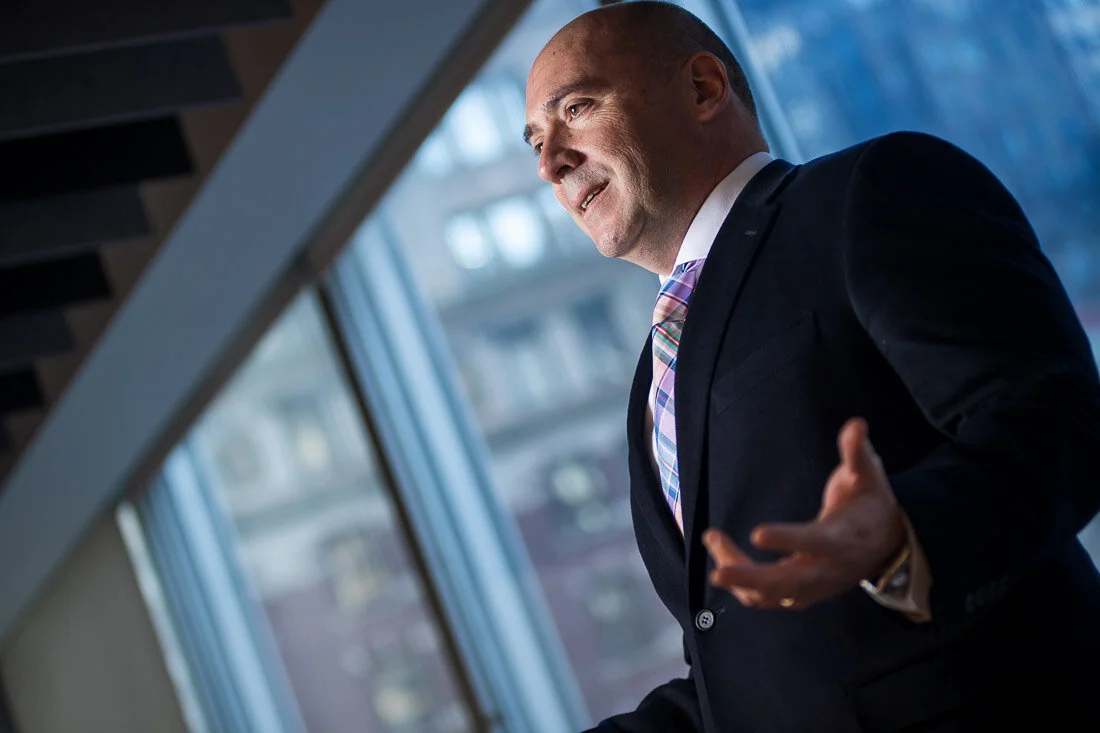 NYC personal branding photography CEO Ray Kober confidently speaking to an audience