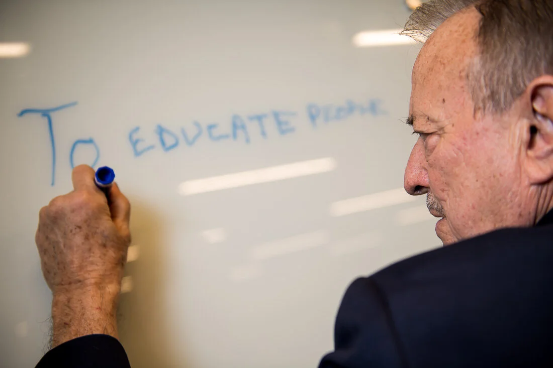NYC Personal branding photography Speaker Author Tony Morante writing on white board