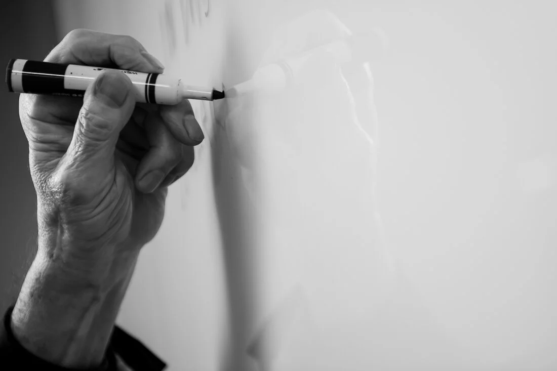 NYC Personal branding photography Speaker Author Tony Morante hand close writing on white board