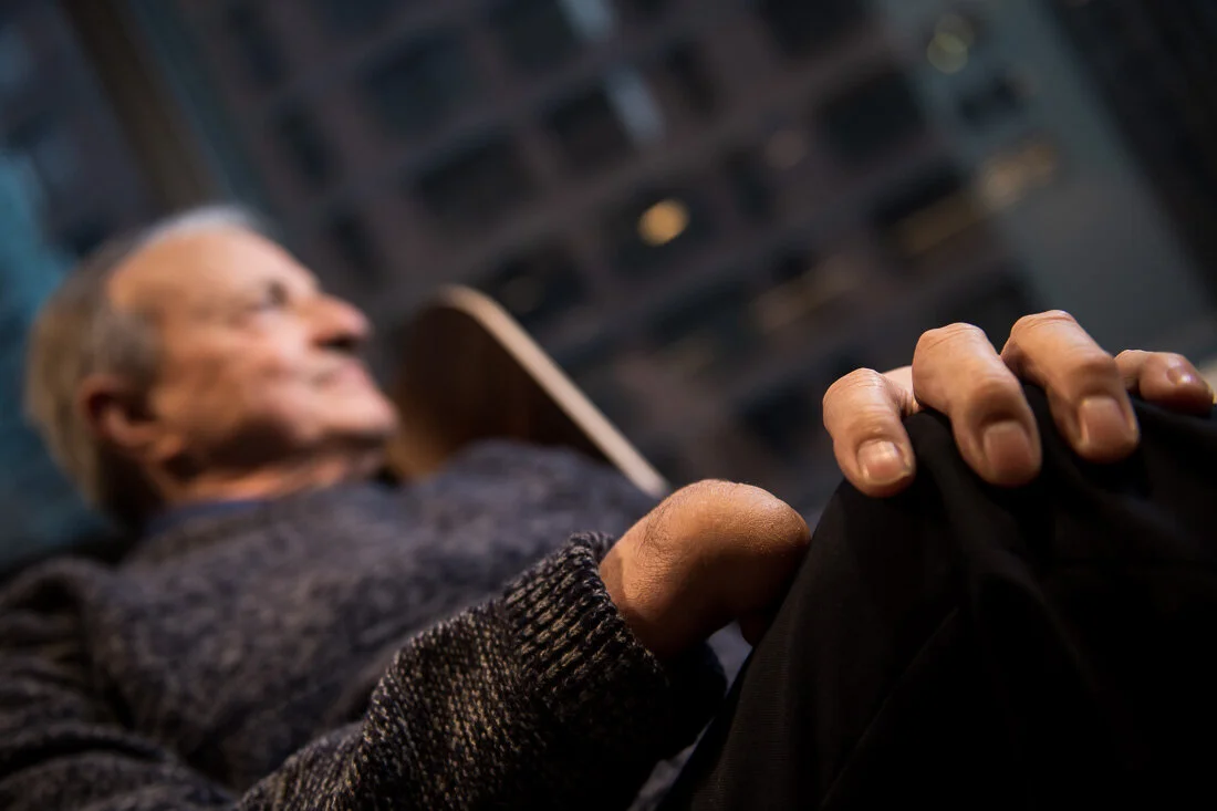 NYC Personal branding photography Speaker Author Tony Morante hands close up while he's looking out window