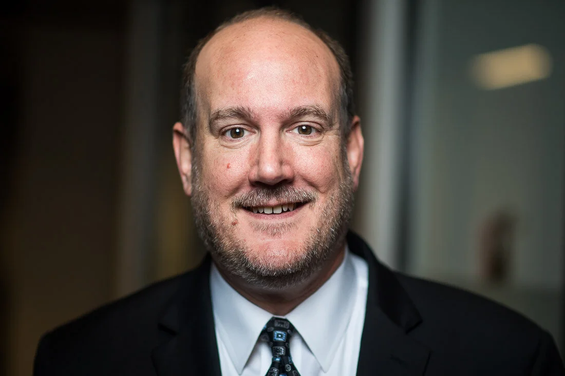 NYC personal branding photography Speaker Consultant Ken Blackwell tight headshot smiling