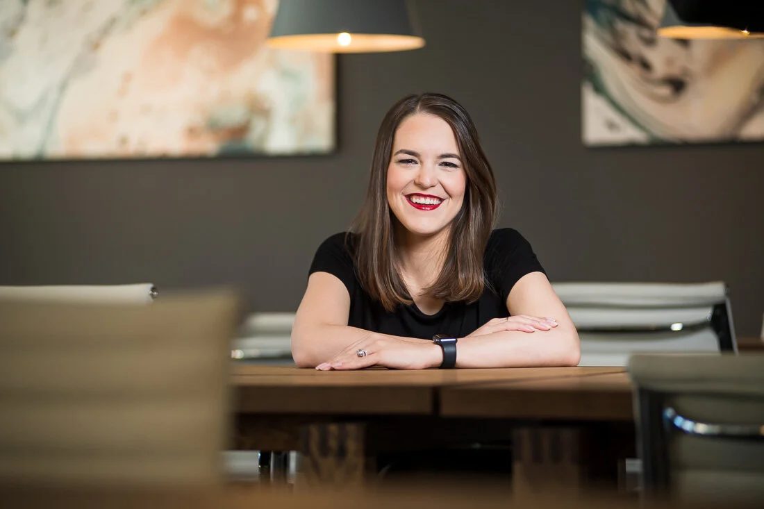 NYC personal branding photo Speaker Author Melanie Deziel smiling and looking into camera